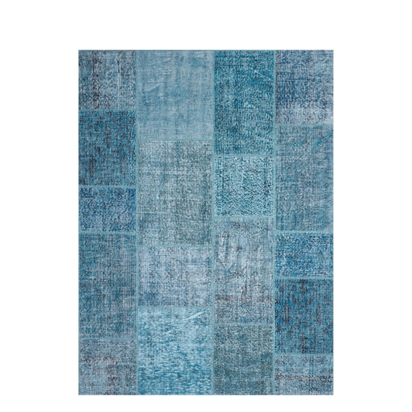 Handgeknoopt vloerkleed Ankara van Perez met rijke wolstructuur in een warm en stijlvol interieur